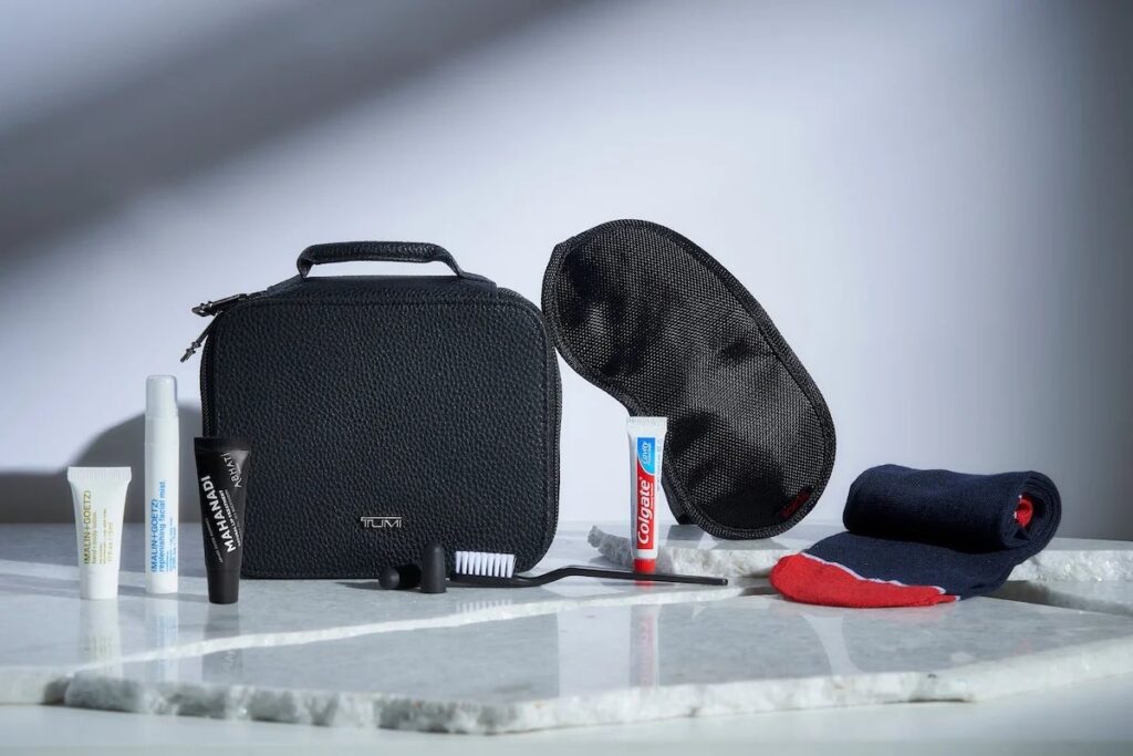 a black bag with a pair of socks and toothpaste