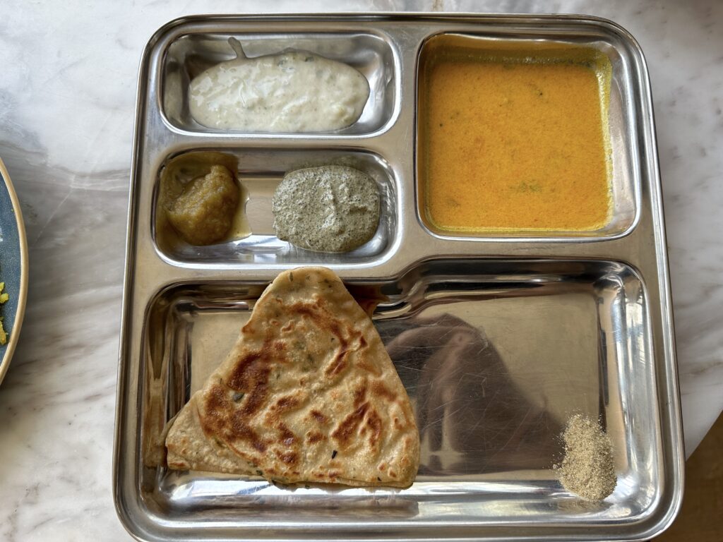 a tray of food on a marble surface