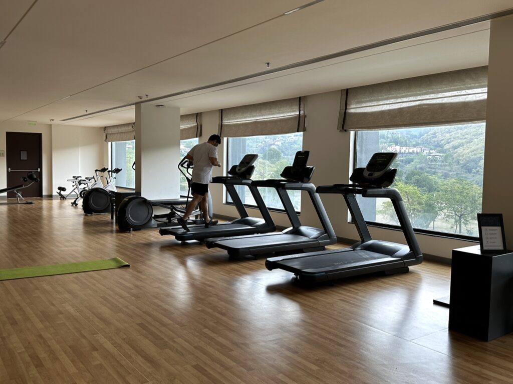 a man on treadmills in a gym