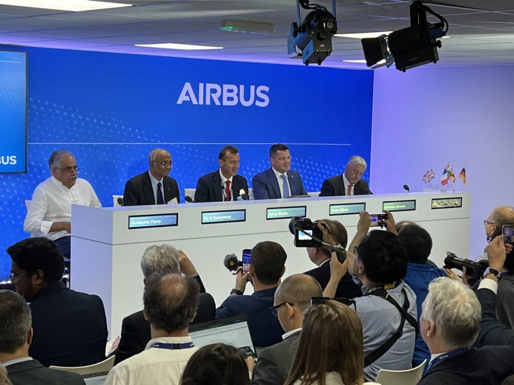 a group of people sitting at a podium