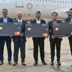 a group of men holding up credit cards