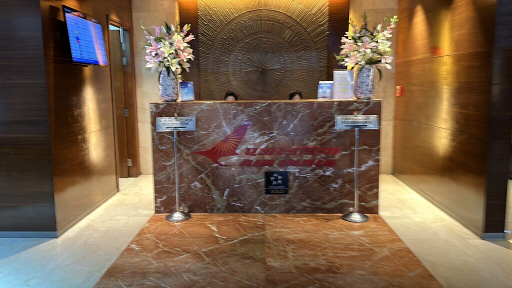 a marble counter with flowers in front of a lobby