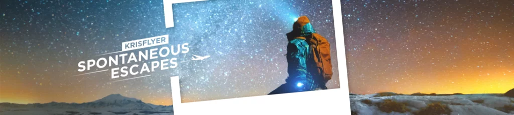 a person with a backpack looking at the stars