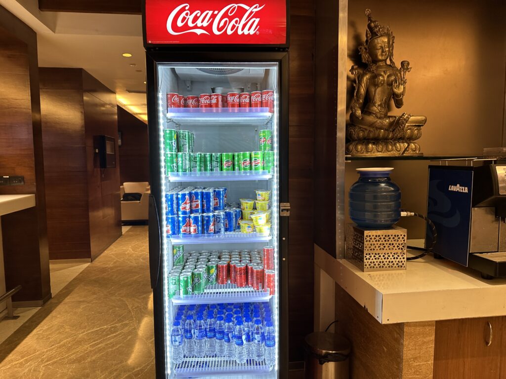 a refrigerator with drinks and cans