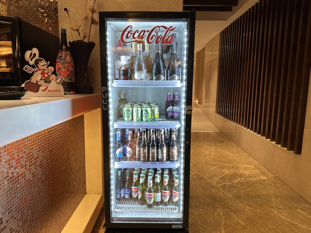 a refrigerator with bottles of beer