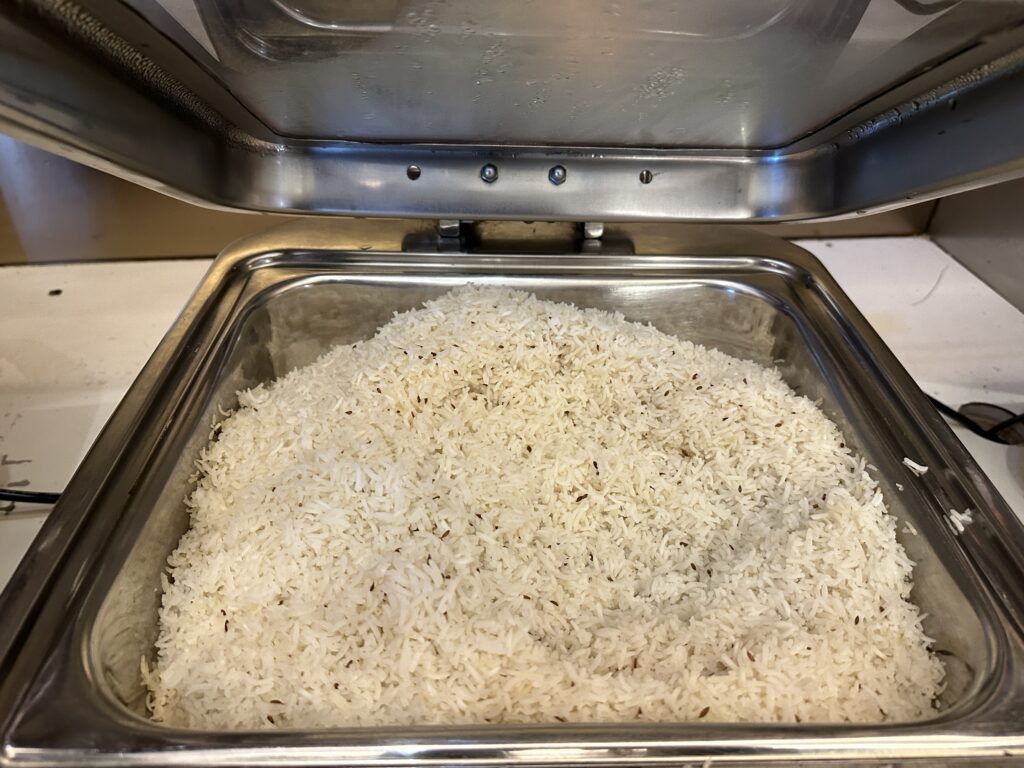 a metal container with rice in it