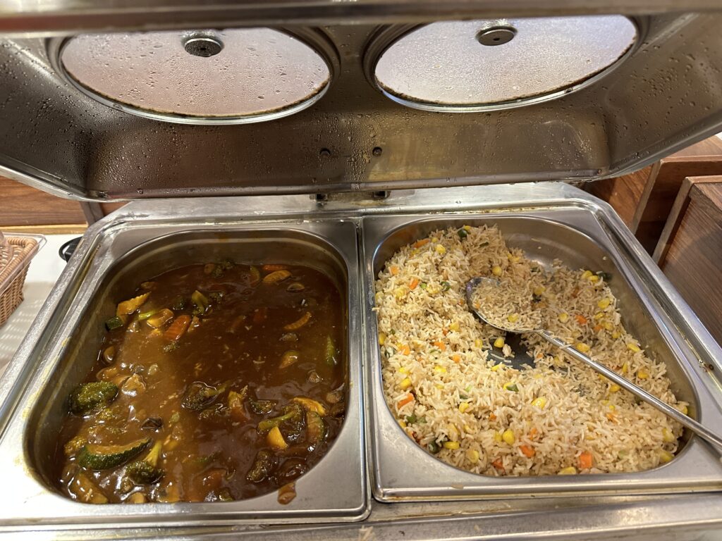 a tray of food with a spoon