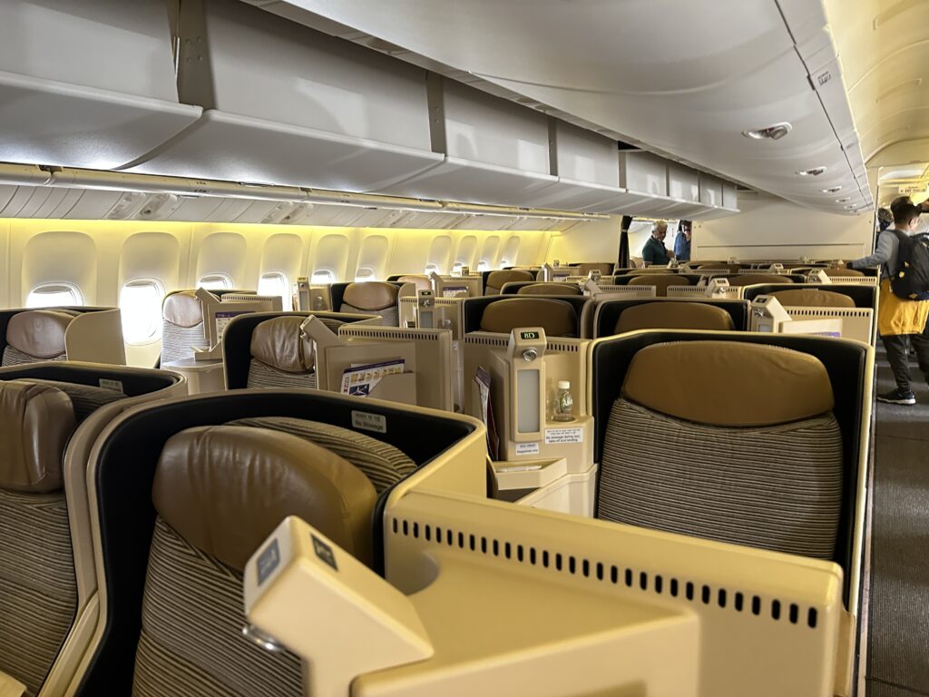 an airplane with seats and a few people