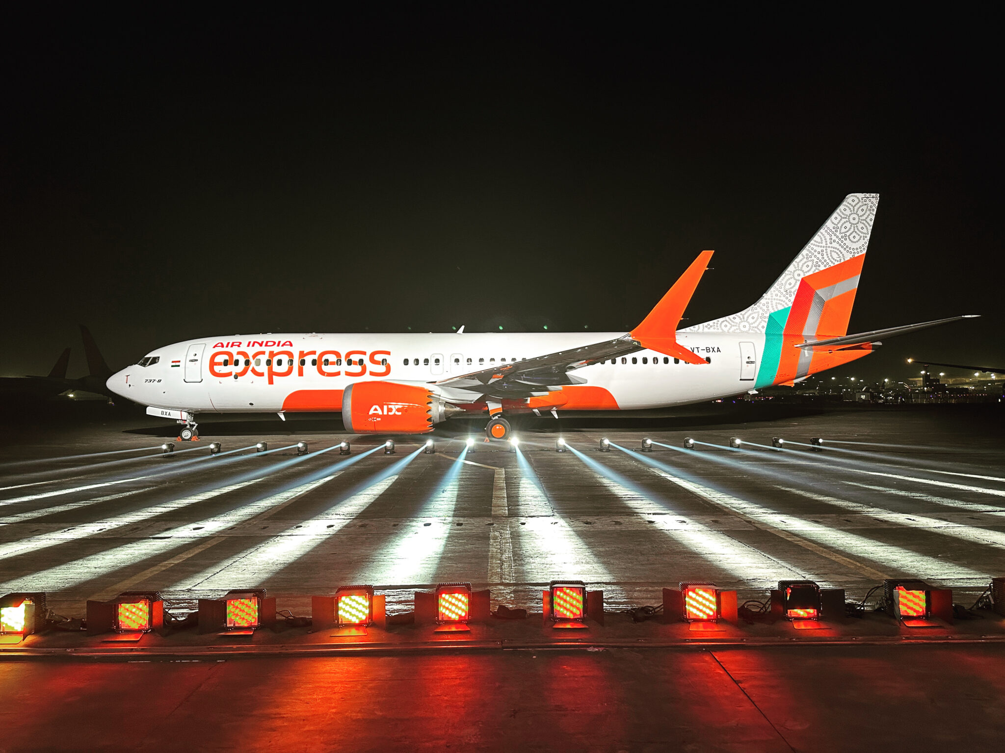 an airplane on a runway at night