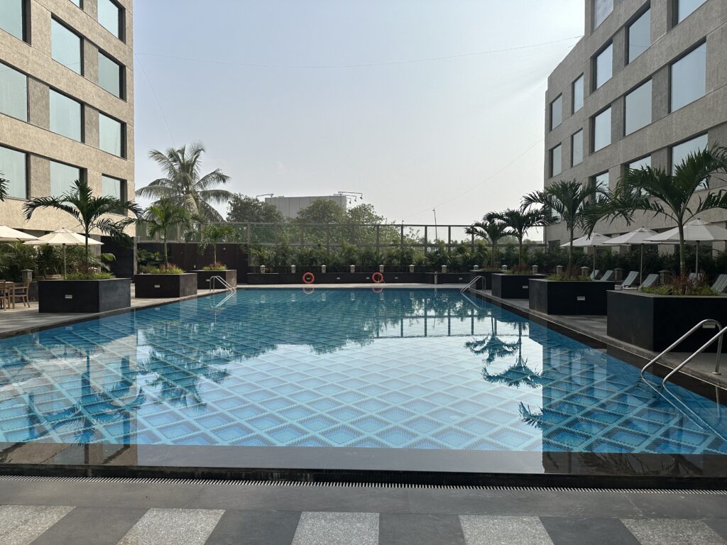 a pool with a building in the background