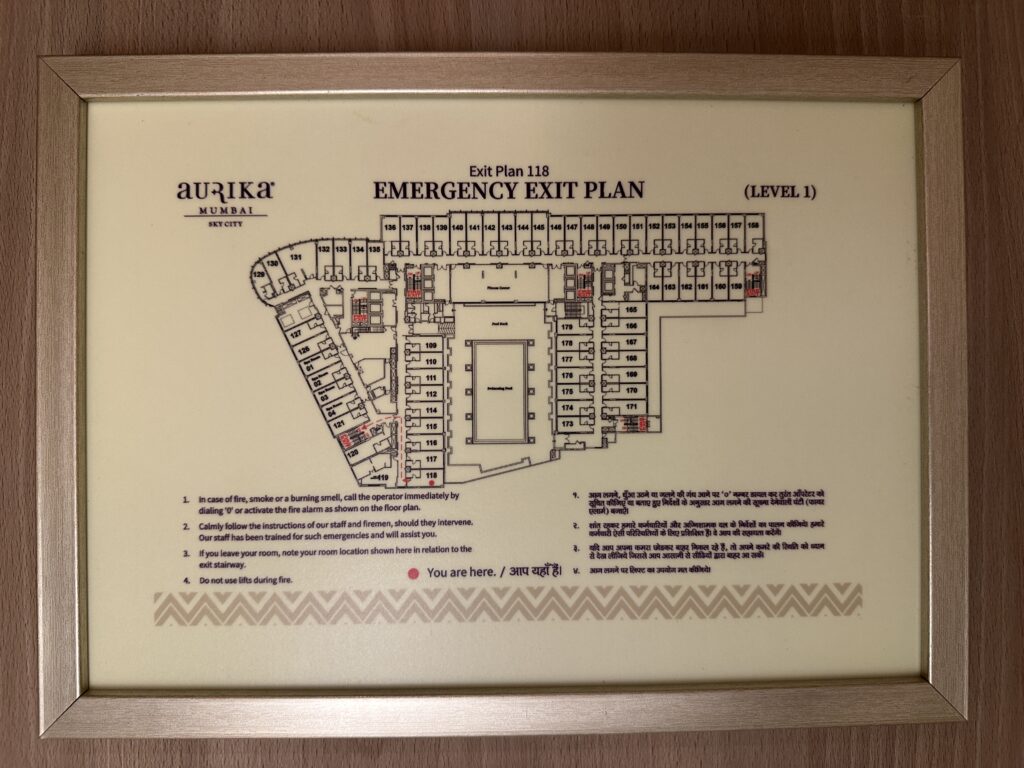 a sign with a map of an emergency exit plan