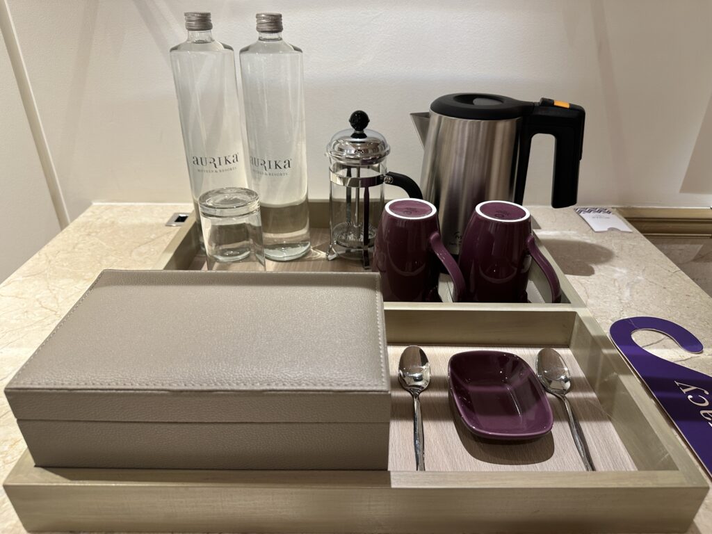 a tray with a tray of tea and coffee cups and a box