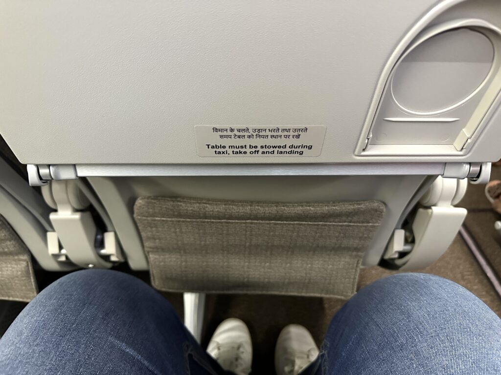 a person's legs and a seat