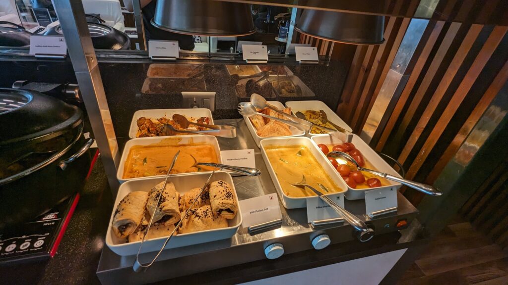 a trays of food on a counter