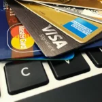 a group of credit cards on a keyboard