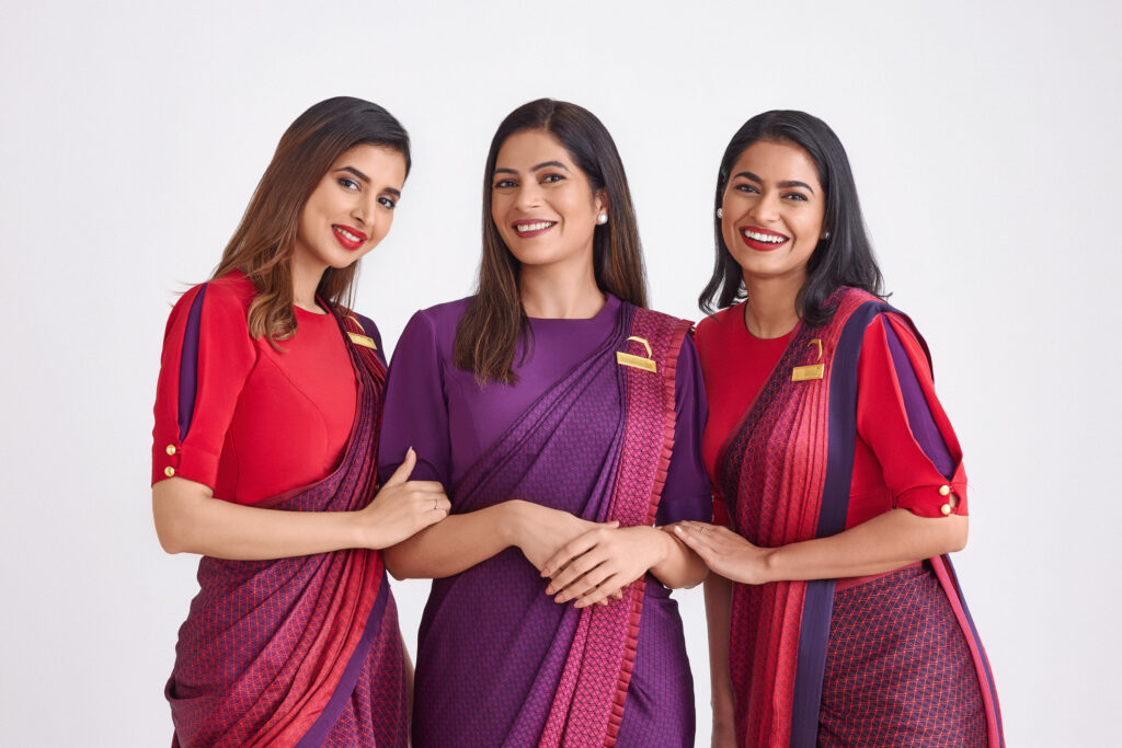 a group of women wearing colorful dresses