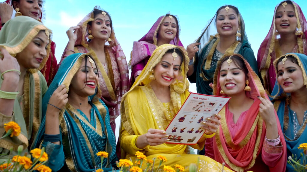 a group of women wearing colorful dresses