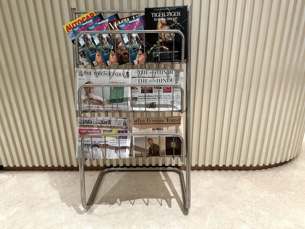 a metal rack with magazines and books