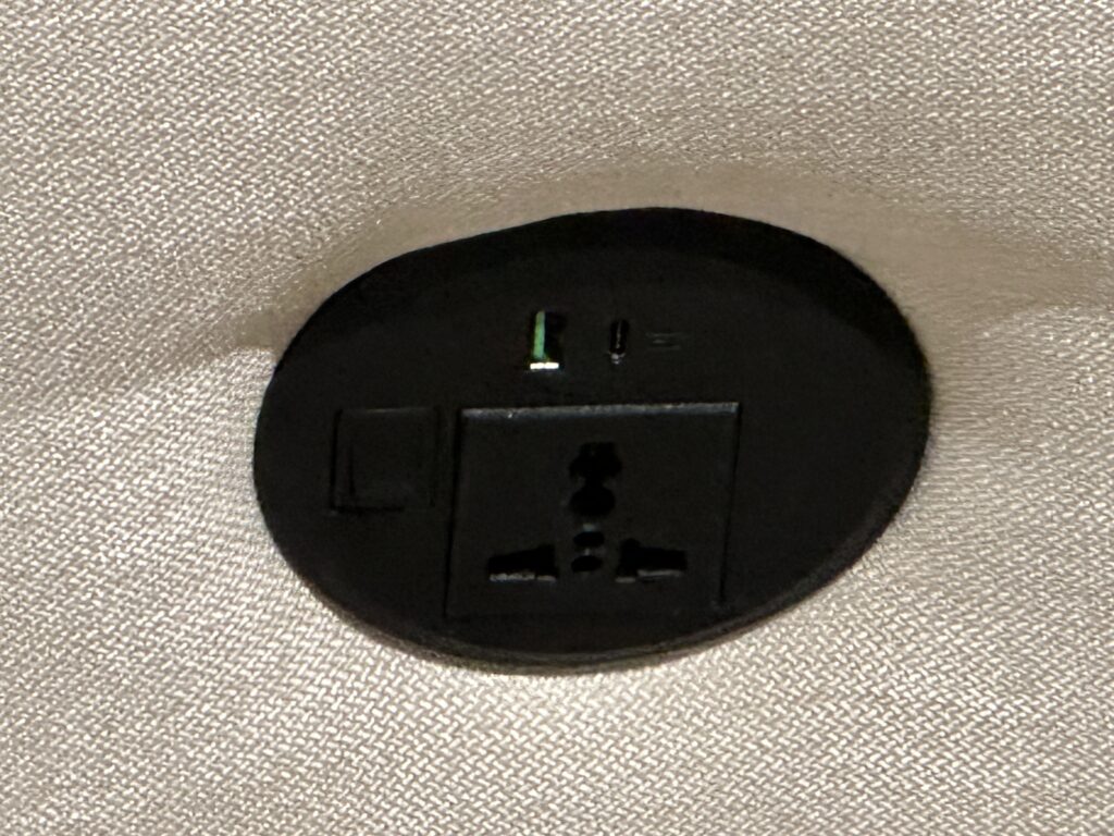 a black electrical outlet on a white surface