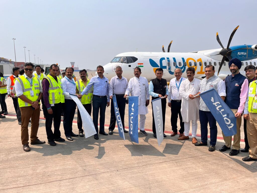 a group of people standing in front of a plane