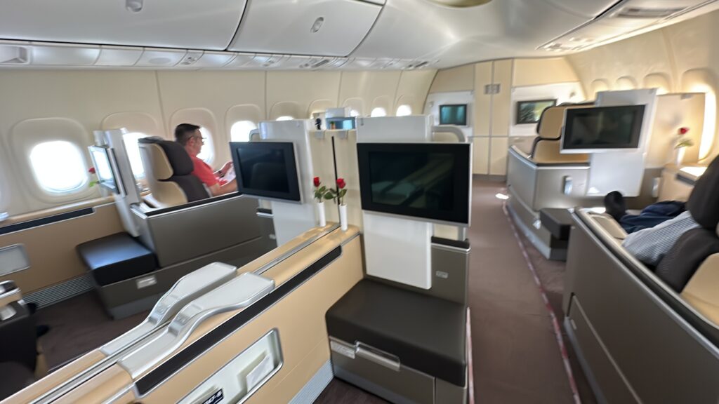 a seat and tv in an airplane