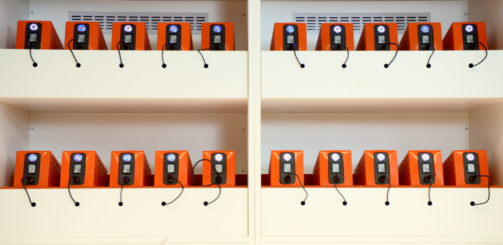 a group of orange boxes on a shelf