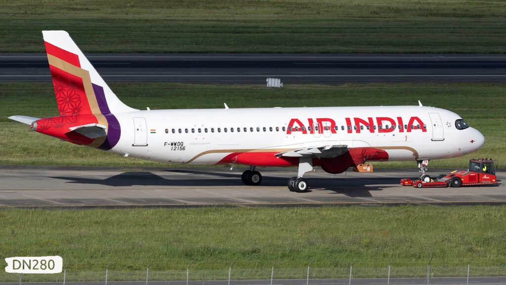 a white and red airplane on a runway