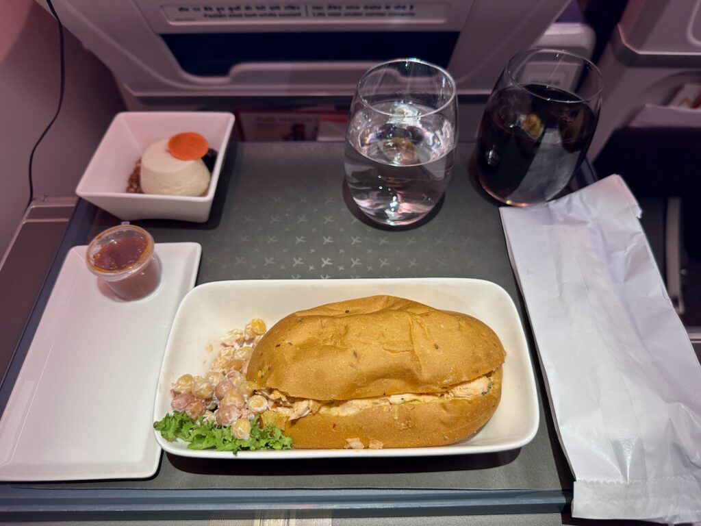 a sandwich and salad on a tray