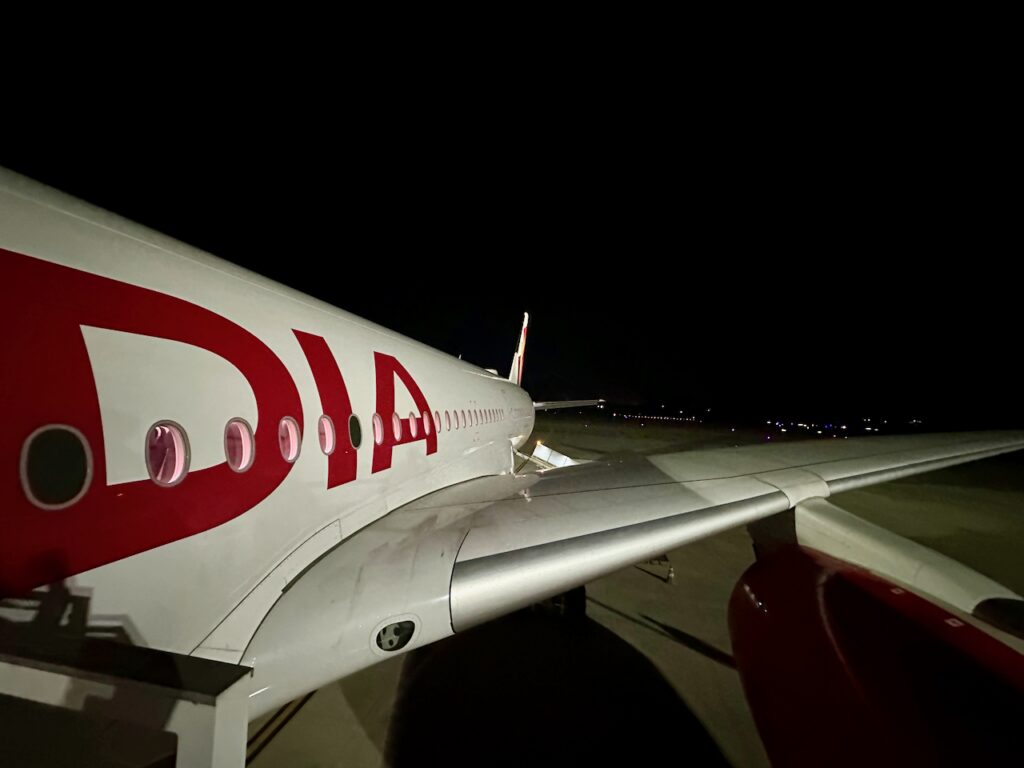 the wing of a plane at night