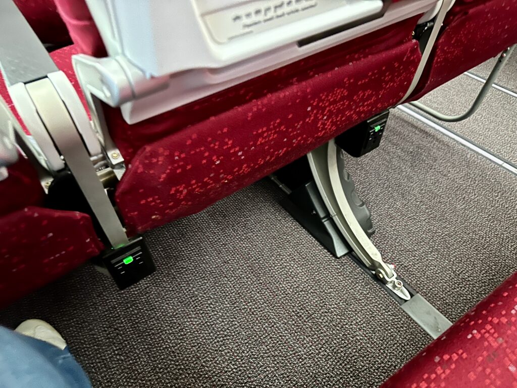 a seat with a red seat and a white seat