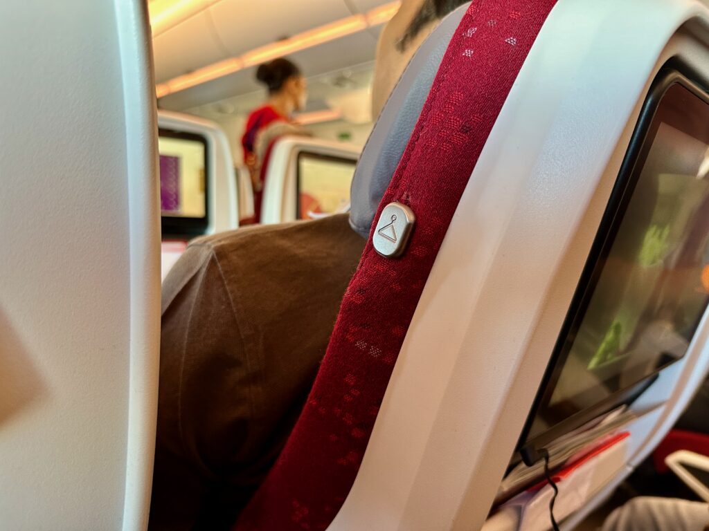 a seat belt on a plane