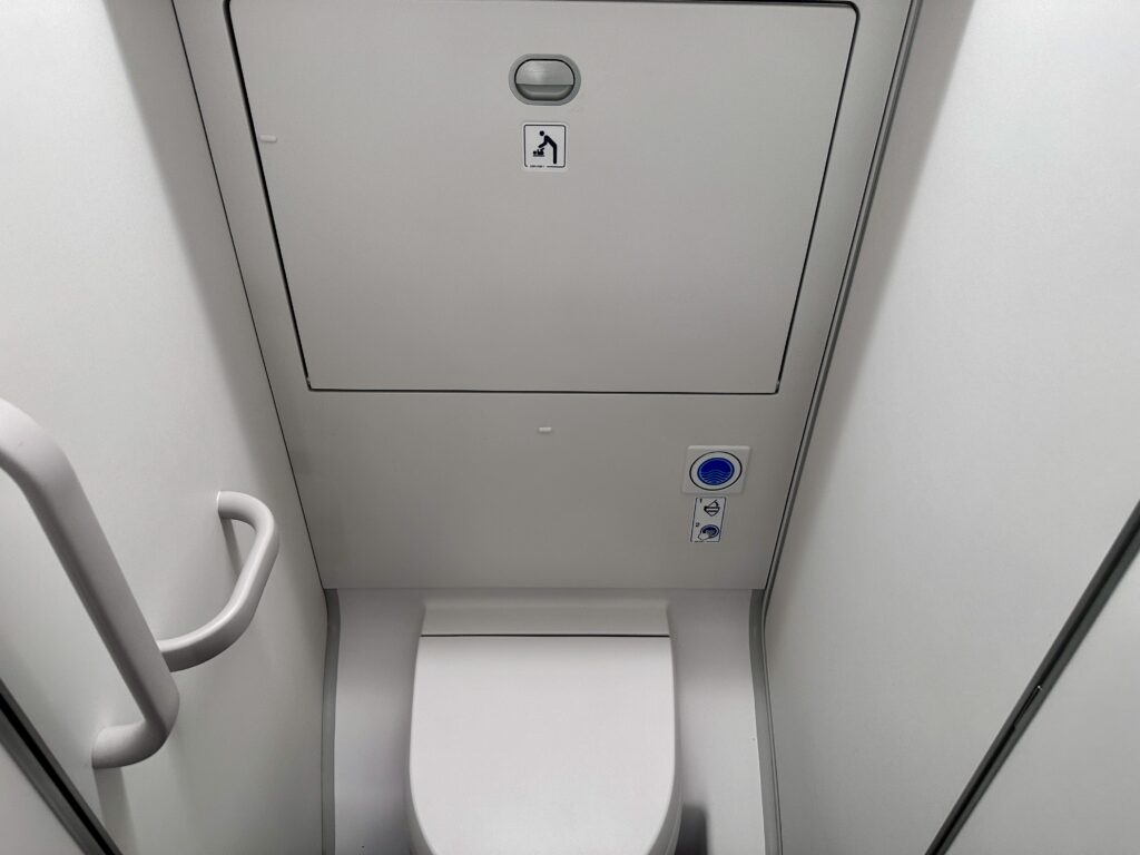 a toilet in a small bathroom