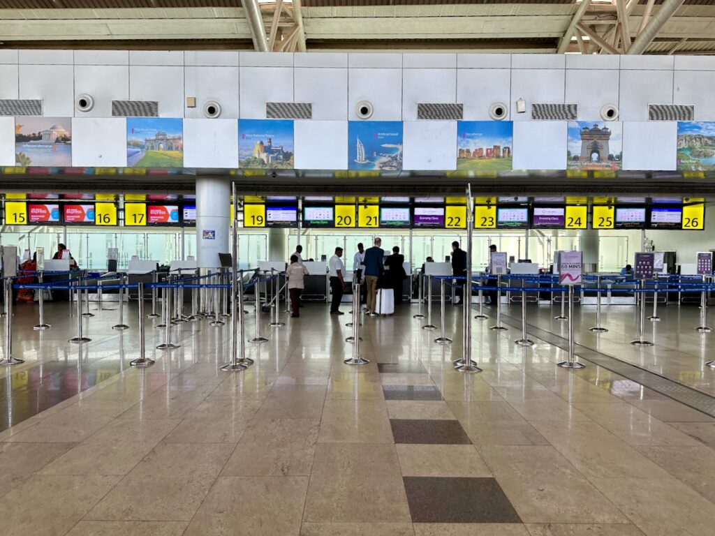 people standing in a line in an airport