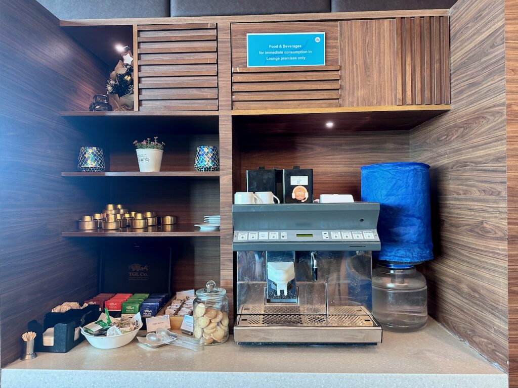 a coffee machine and other items on a shelf