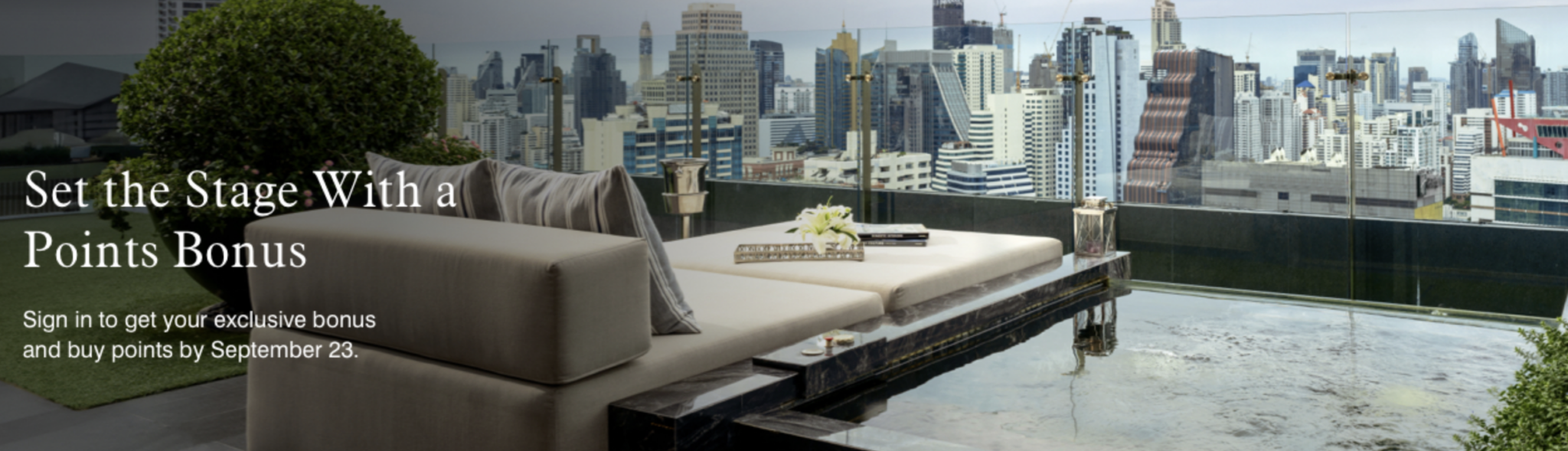 a couches on a balcony overlooking a city