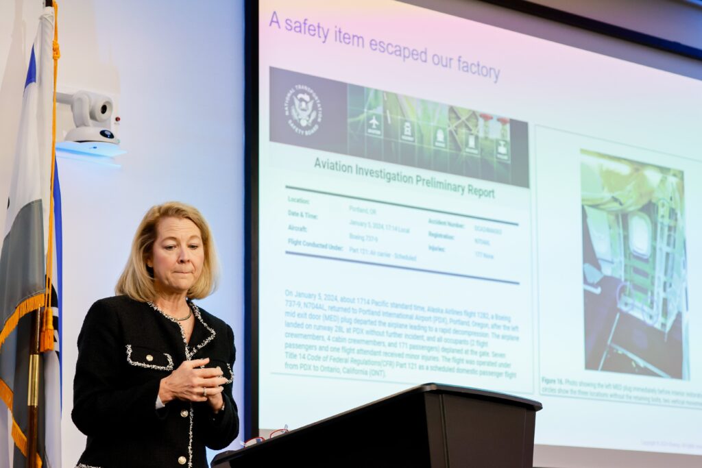 a woman standing at a podium