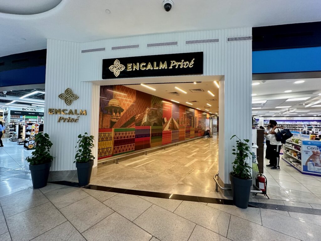 a building with a sign and a large doorway