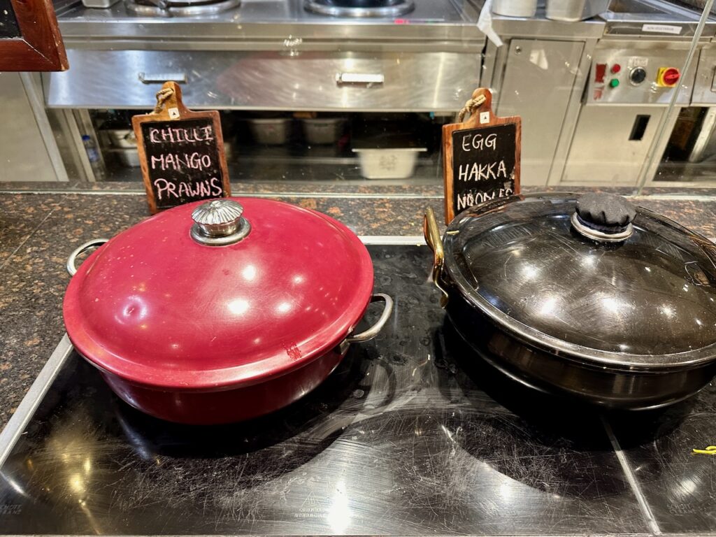 a red and black pots on a stove