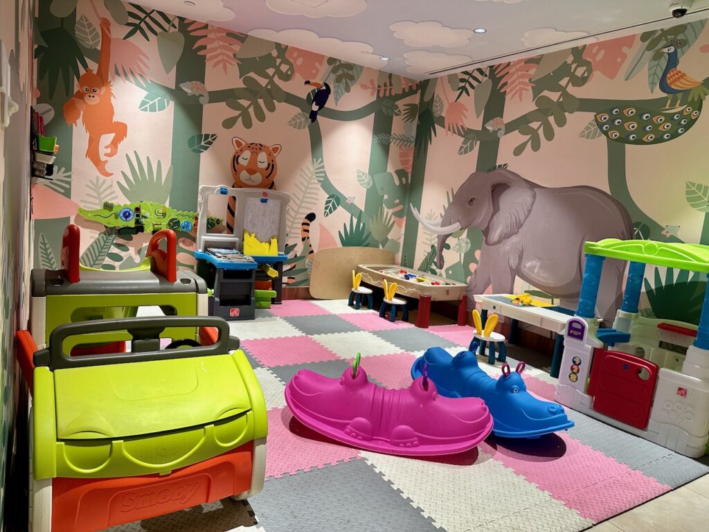 a room with toys and a wallpaper