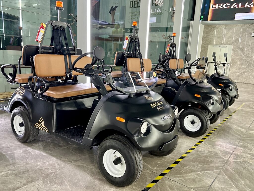 a group of golf carts in a building