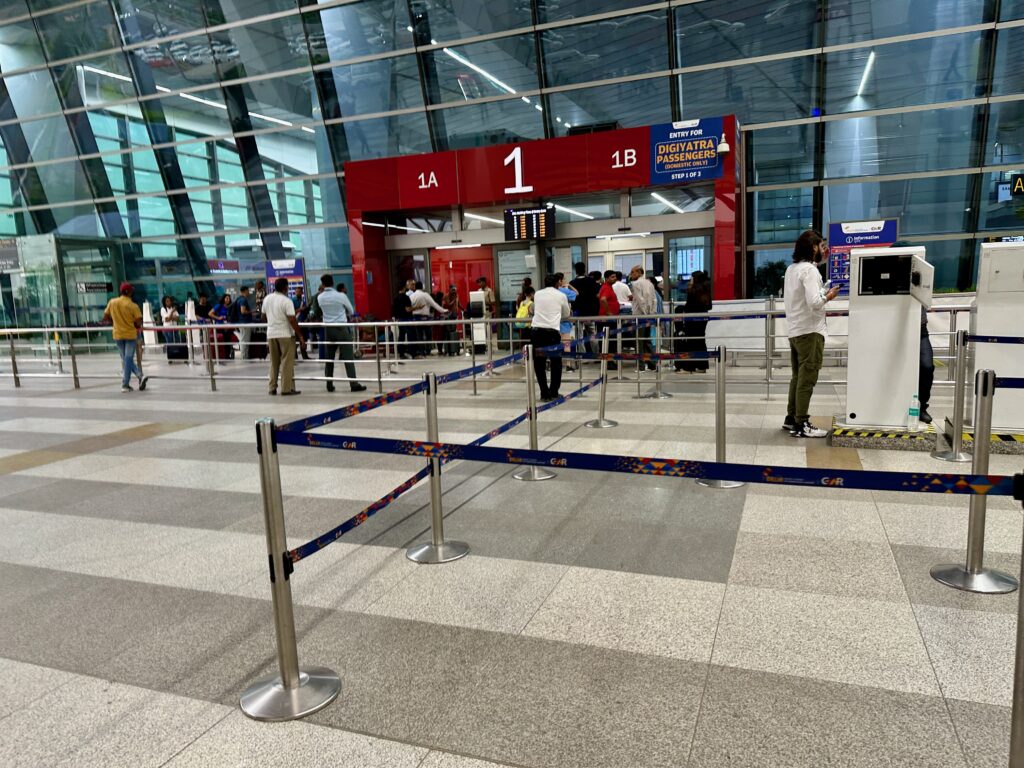 people standing in a line in a terminal