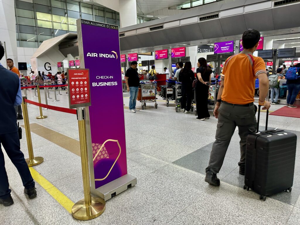 a man with luggage in an airport