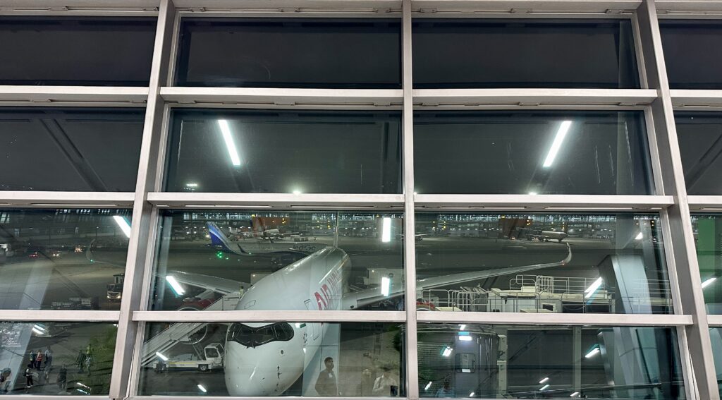 a window with a plane in it