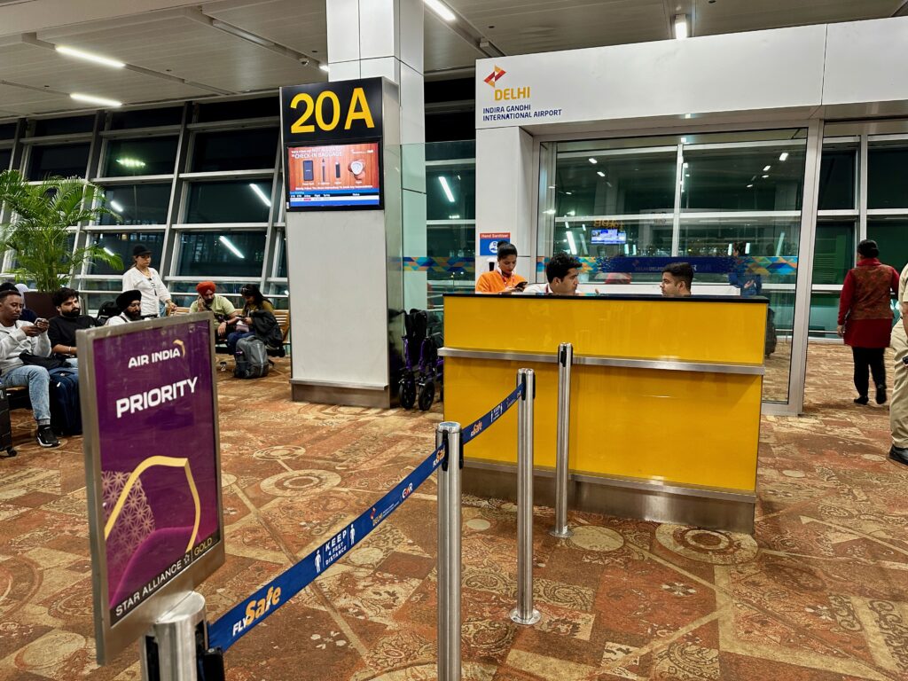 people at a counter in an airport