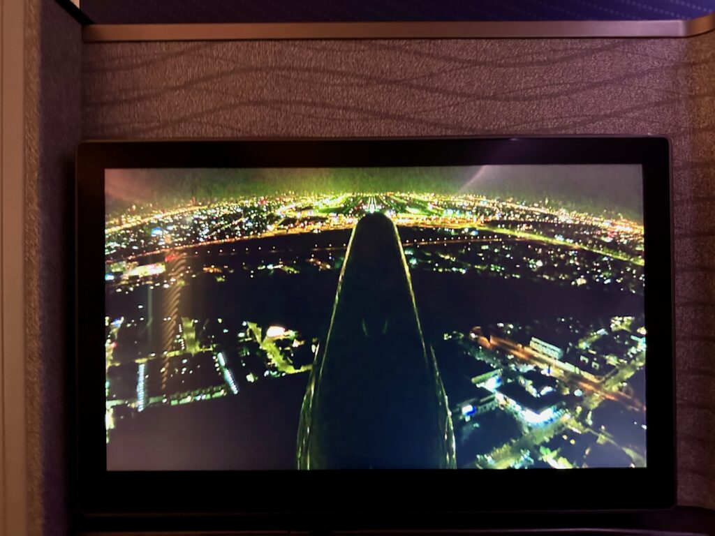 a screen with a picture of a city at night