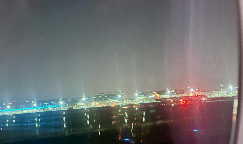 a plane on the runway at night