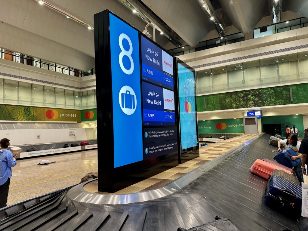 a large screen with a large screen on it in a airport