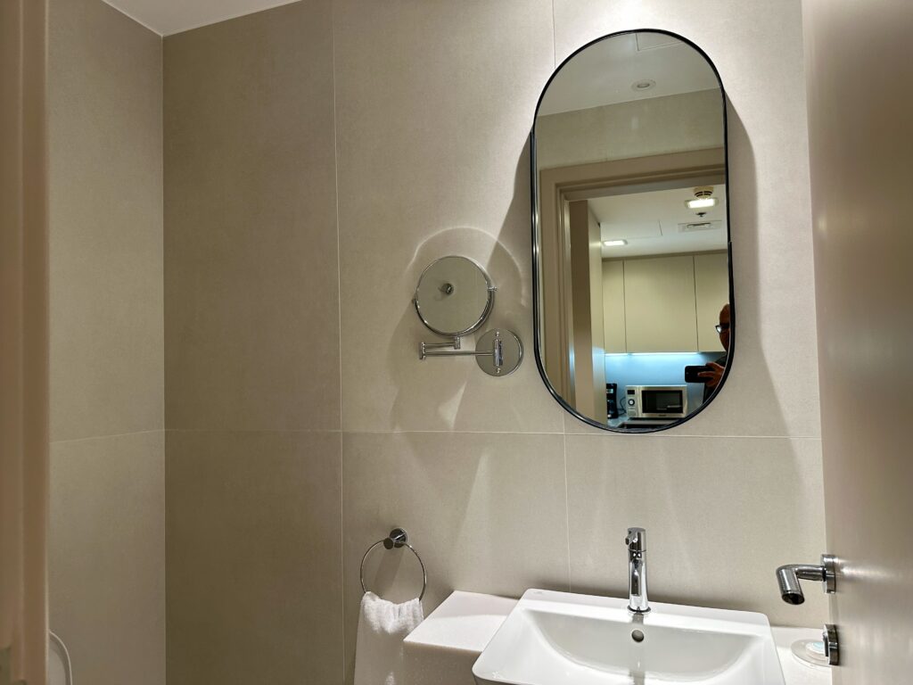 a mirror above a sink