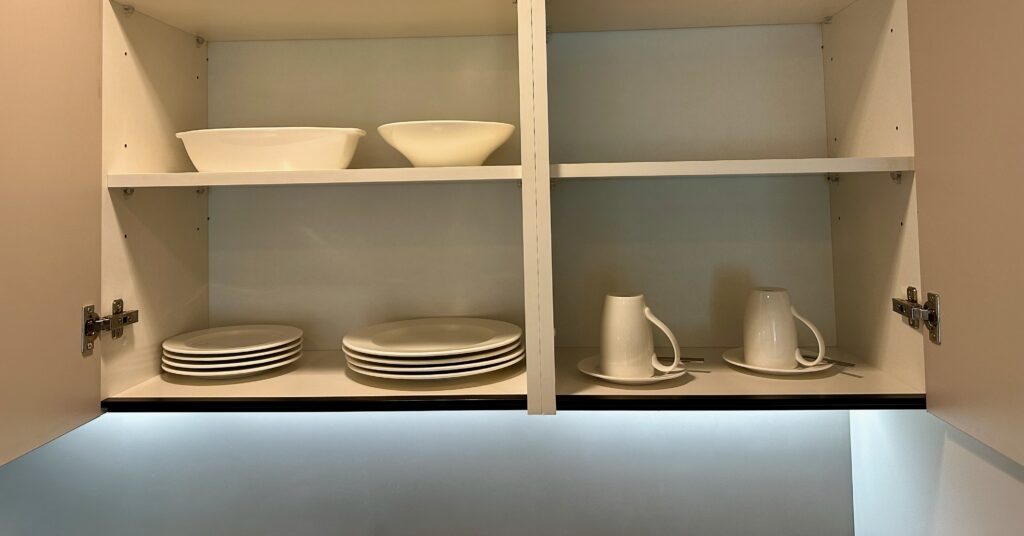 a shelf with plates and bowls on it