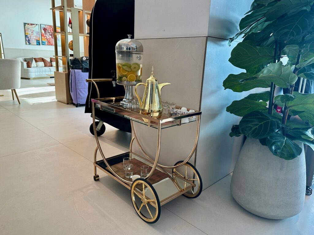 a tea cart with a teapot and lemons on it